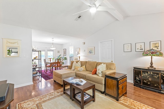 1304 Mallard Dr, Franklin, TN 37064 - living area featuring baseboards, lofted ceiling with beams, visible vents, ceiling fan, and wood finished floors