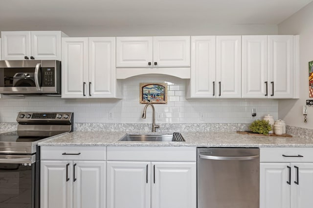 1304 Mallard Dr, Franklin, TN 37064 - kitchen with appliances with stainless steel finishes, a sink, and white cabinets
