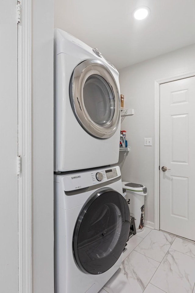 1304 Mallard Dr, Franklin, TN 37064 - washroom with marble finish floor, stacked washer and dryer, and laundry area