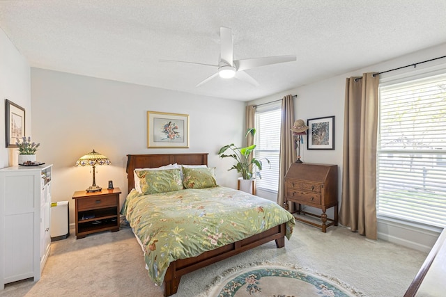 1304 Mallard Dr, Franklin, TN 37064 - bedroom featuring a textured ceiling, light colored carpet, ceiling fan, and baseboards