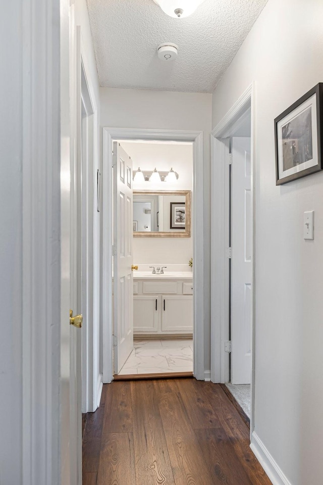 1304 Mallard Dr, Franklin, TN 37064 - hall with a textured ceiling, wood finished floors, and a sink