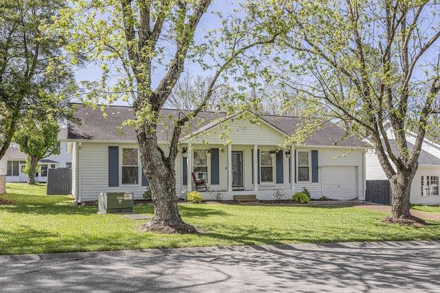 1304 Mallard Dr, Franklin, TN 37064 - view of front of house featuring driveway, a garage, fence, and a front lawn