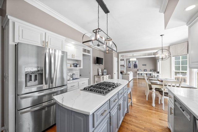 2553 Stone Briar Dr, Clarksville, TN 37043 - kitchen featuring an inviting chandelier, gray cabinets, a center island, white cabinetry, and appliances with stainless steel finishes