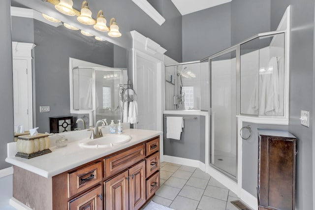 bathroom featuring a shower stall, tile patterned floors, vanity, and visible vents
