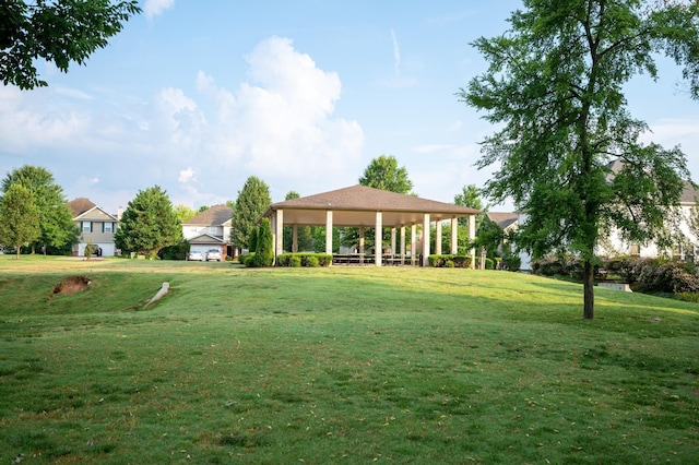 view of community featuring a yard and a gazebo