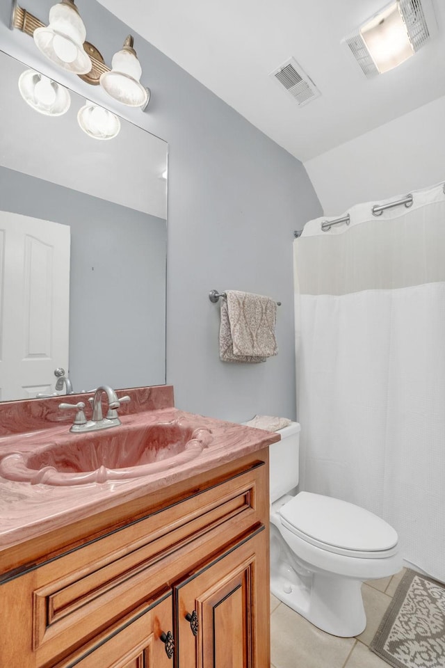 bathroom featuring tile patterned flooring, vanity, visible vents, and toilet