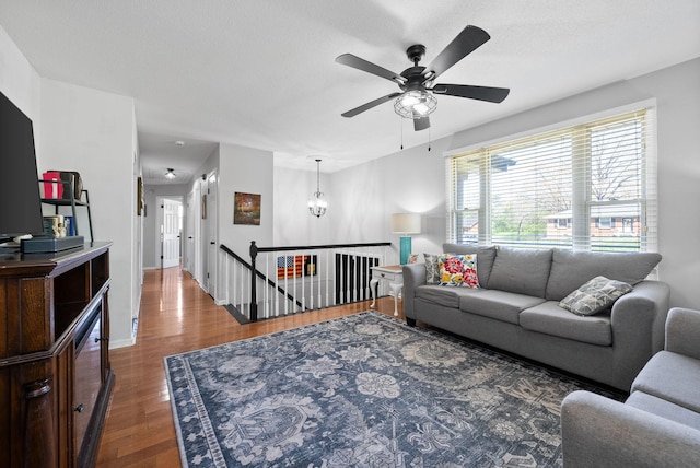 116 Dave Dr, Clarksville, TN 37042 - living area with baseboards, wood finished floors, and ceiling fan with notable chandelier
