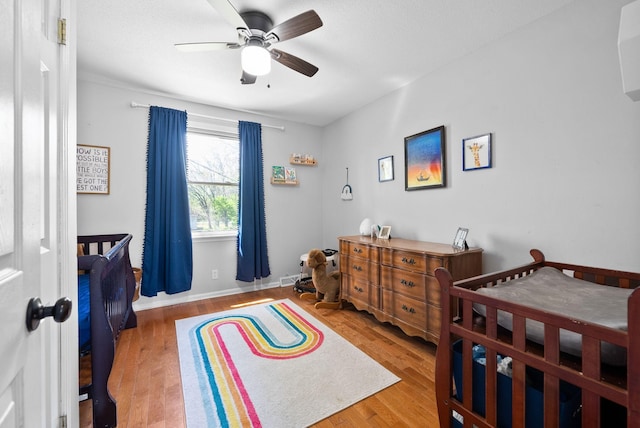 116 Dave Dr, Clarksville, TN 37042 - bedroom featuring baseboards, a ceiling fan, and wood finished floors