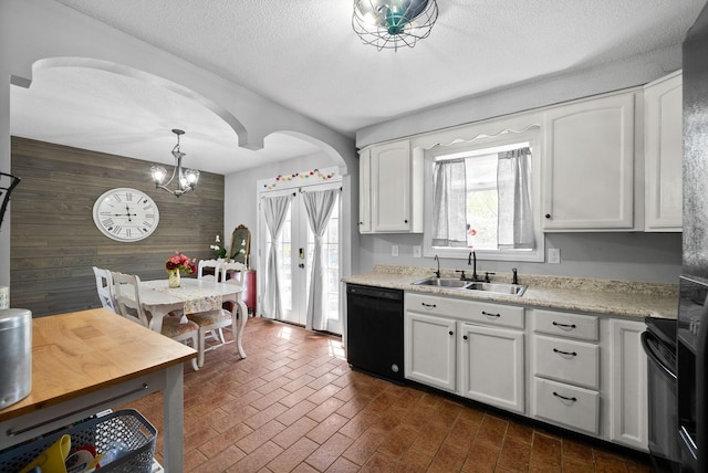 116 Dave Dr, Clarksville, TN 37042 - kitchen featuring light countertops, wood walls, black appliances, brick floor, and a sink