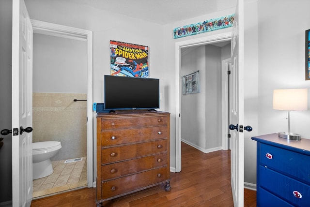 116 Dave Dr, Clarksville, TN 37042 - bedroom featuring ensuite bath, tile walls, and wood finished floors