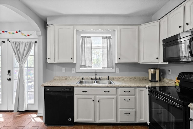 116 Dave Dr, Clarksville, TN 37042 - kitchen featuring a sink, light countertops, white cabinets, and black appliances