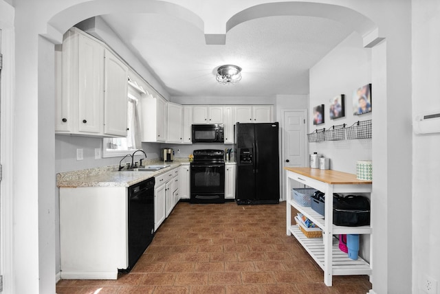 116 Dave Dr, Clarksville, TN 37042 - kitchen featuring a sink, white cabinetry, and black appliances