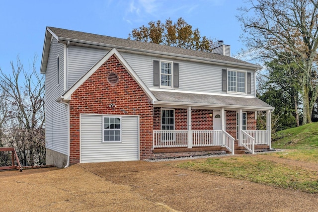 traditional home featuring a porch, a shingled roof, and a chimney