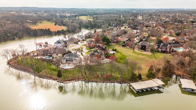 birds eye view of property with a water view and a residential view