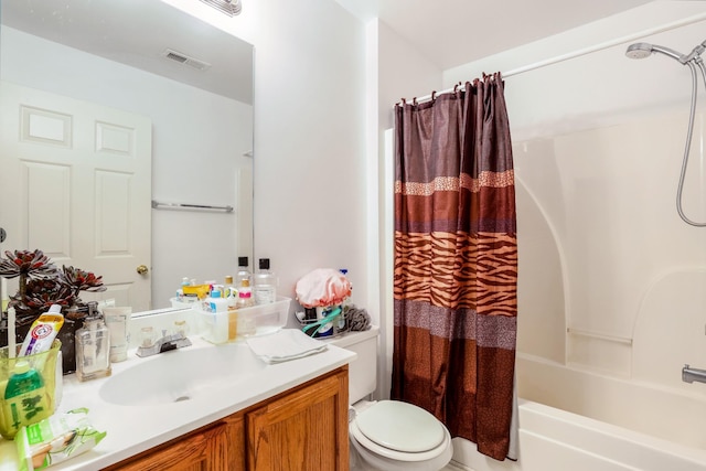 bathroom featuring shower / bath combo, visible vents, toilet, and vanity