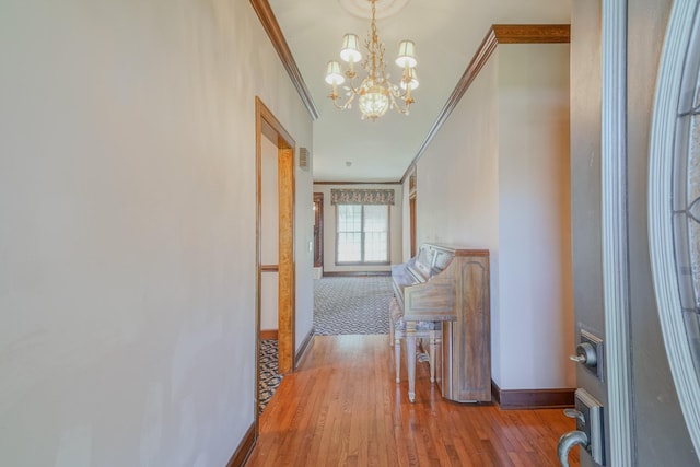 107 Geers Ct, Lebanon, TN 37087 - hallway with crown molding, wood finished floors, an inviting chandelier, and baseboards