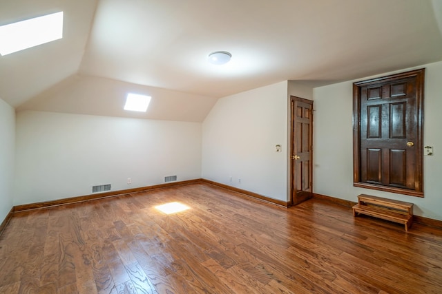 107 Geers Ct, Lebanon, TN 37087 - additional living space featuring vaulted ceiling with skylight, visible vents, baseboards, and wood finished floors