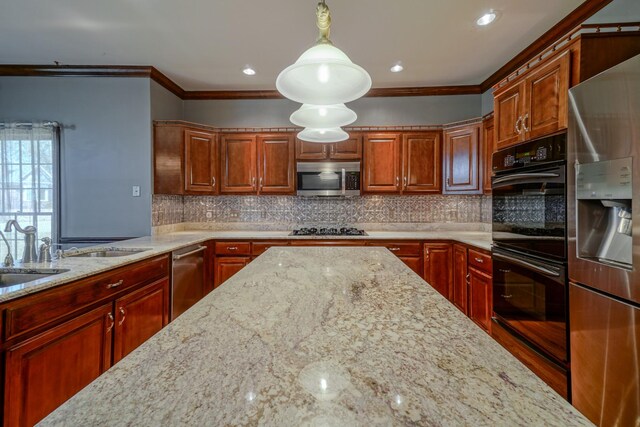 107 Geers Ct, Lebanon, TN 37087 - kitchen with stainless steel appliances, crown molding, light stone counters, and decorative backsplash