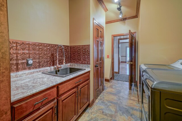 107 Geers Ct, Lebanon, TN 37087 - laundry room with independent washer and dryer, track lighting, ornamental molding, a sink, and cabinet space