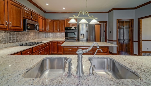 107 Geers Ct, Lebanon, TN 37087 - kitchen with stainless steel appliances, light stone counters, and decorative backsplash