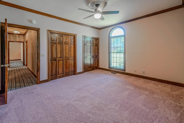 107 Geers Ct, Lebanon, TN 37087 - unfurnished bedroom featuring multiple closets, carpet, visible vents, and ornamental molding