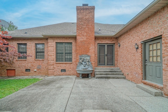 107 Geers Ct, Lebanon, TN 37087 - rear view of house featuring entry steps, a shingled roof, a patio, and a chimney