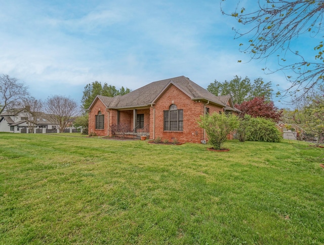 107 Geers Ct, Lebanon, TN 37087 - exterior space with roof with shingles, a lawn, and brick siding