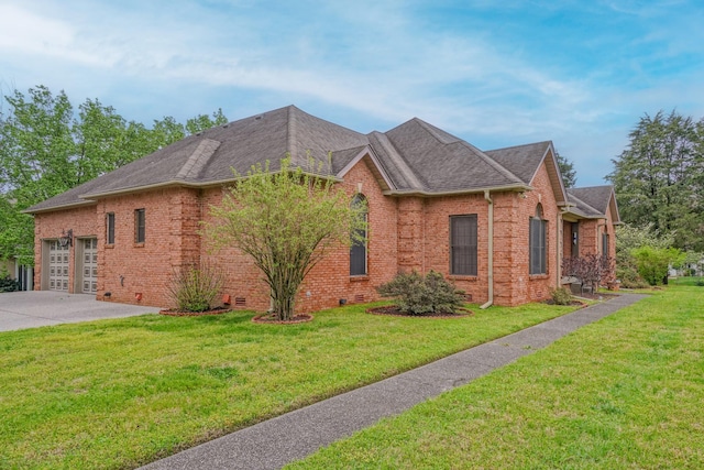 107 Geers Ct, Lebanon, TN 37087 - view of side of home with concrete driveway, a yard, brick siding, and an attached garage