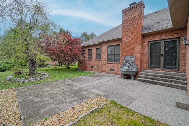 107 Geers Ct, Lebanon, TN 37087 - rear view of property with a lawn, entry steps, a patio, a chimney, and a shingled roof