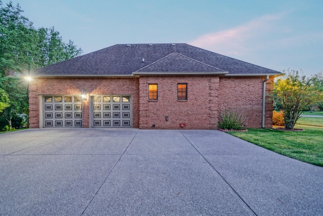107 Geers Ct, Lebanon, TN 37087 - view of side of home featuring a yard, roof with shingles, a garage, and concrete driveway