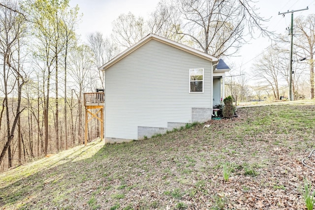 view of side of property featuring crawl space