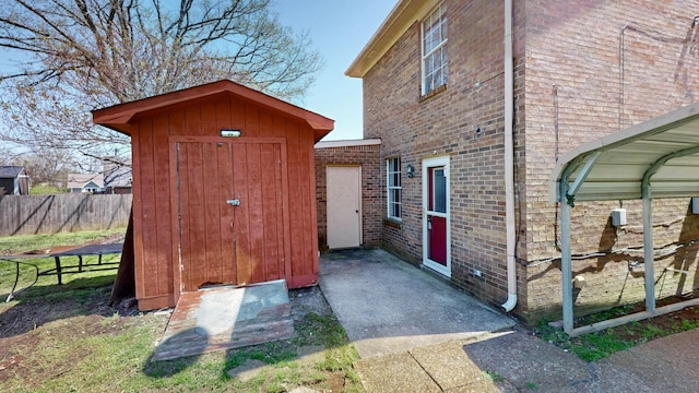view of shed with fence