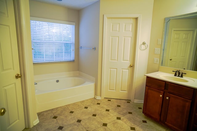 bathroom with vanity and a garden tub
