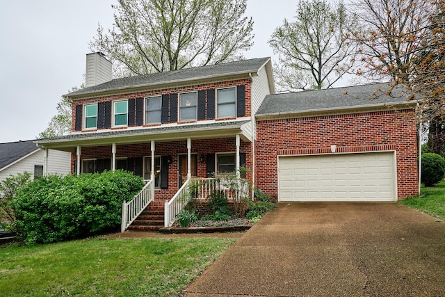 colonial inspired home with a porch, a chimney, concrete driveway, and brick siding