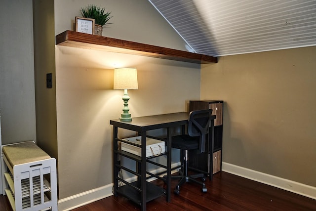 office with baseboards, vaulted ceiling, and wood finished floors