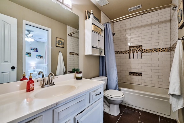 full bath featuring tile patterned floors, shower / bath combo with shower curtain, visible vents, and a ceiling fan