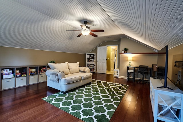 living area with vaulted ceiling, a ceiling fan, and wood finished floors