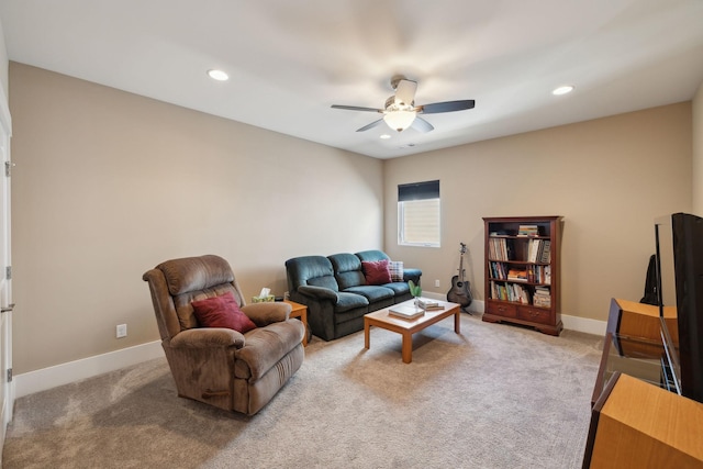 living area with recessed lighting, ceiling fan, light carpet, and baseboards