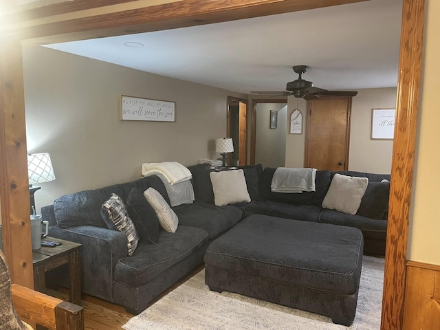 living area featuring wood finished floors and ceiling fan