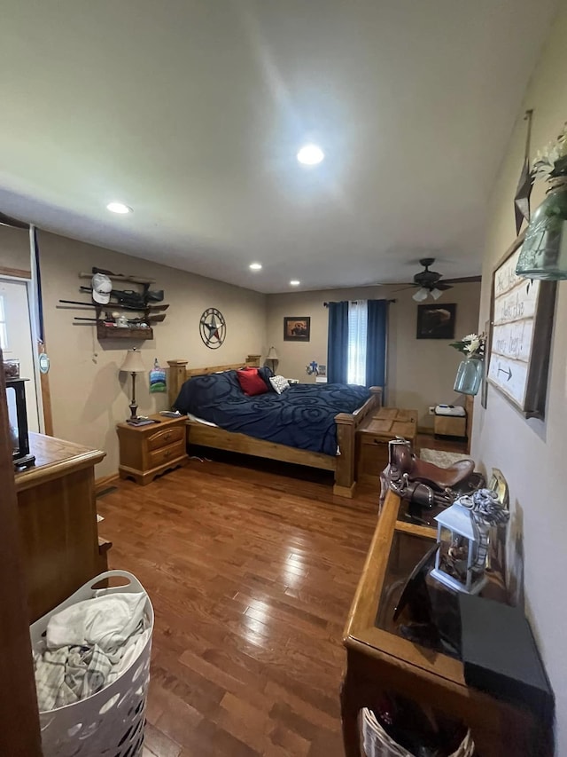 bedroom featuring recessed lighting and wood finished floors
