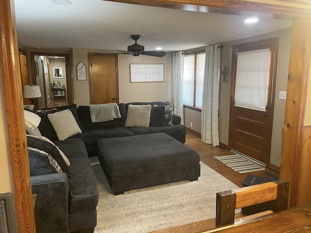 living area with wood finished floors, baseboards, a ceiling fan, and recessed lighting
