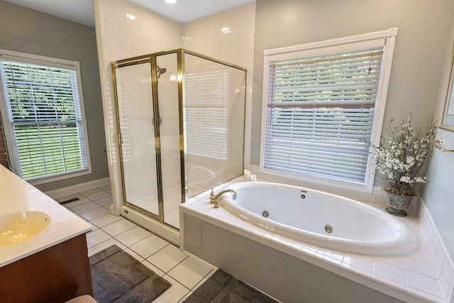 bathroom featuring a shower stall, a jetted tub, vanity, and tile patterned flooring