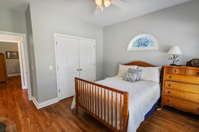 bedroom with wood finished floors, ceiling fan, a closet, and baseboards