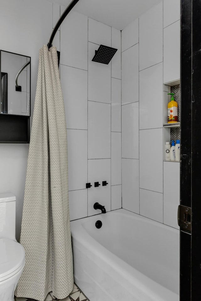 bathroom featuring shower / bath combo and toilet