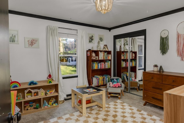 recreation room featuring an inviting chandelier, carpet flooring, and crown molding