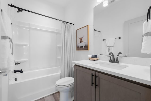 full bath featuring vanity, shower / tub combo with curtain, toilet, visible vents, and wood finished floors