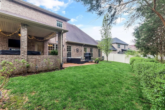 view of yard featuring fence and a patio