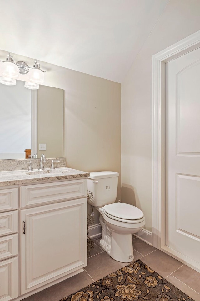 620 Williamson County Line Rd, Fairview, TN 37062 - bathroom featuring toilet, tile patterned floors, vanity, and vaulted ceiling