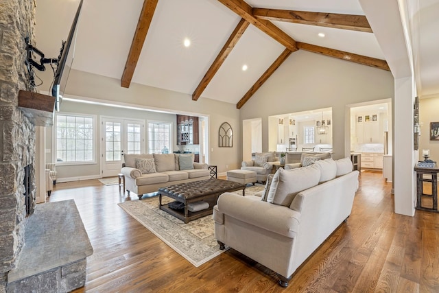 620 Williamson County Line Rd, Fairview, TN 37062 - living room featuring high vaulted ceiling, a fireplace, wood finished floors, baseboards, and beam ceiling