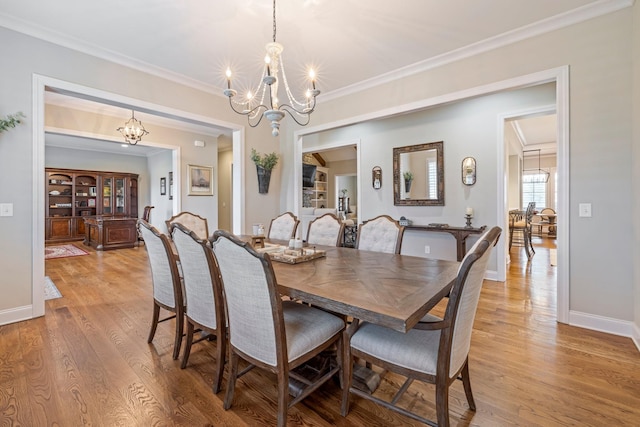 620 Williamson County Line Rd, Fairview, TN 37062 - dining room featuring light wood-style floors, an inviting chandelier, baseboards, and ornamental molding